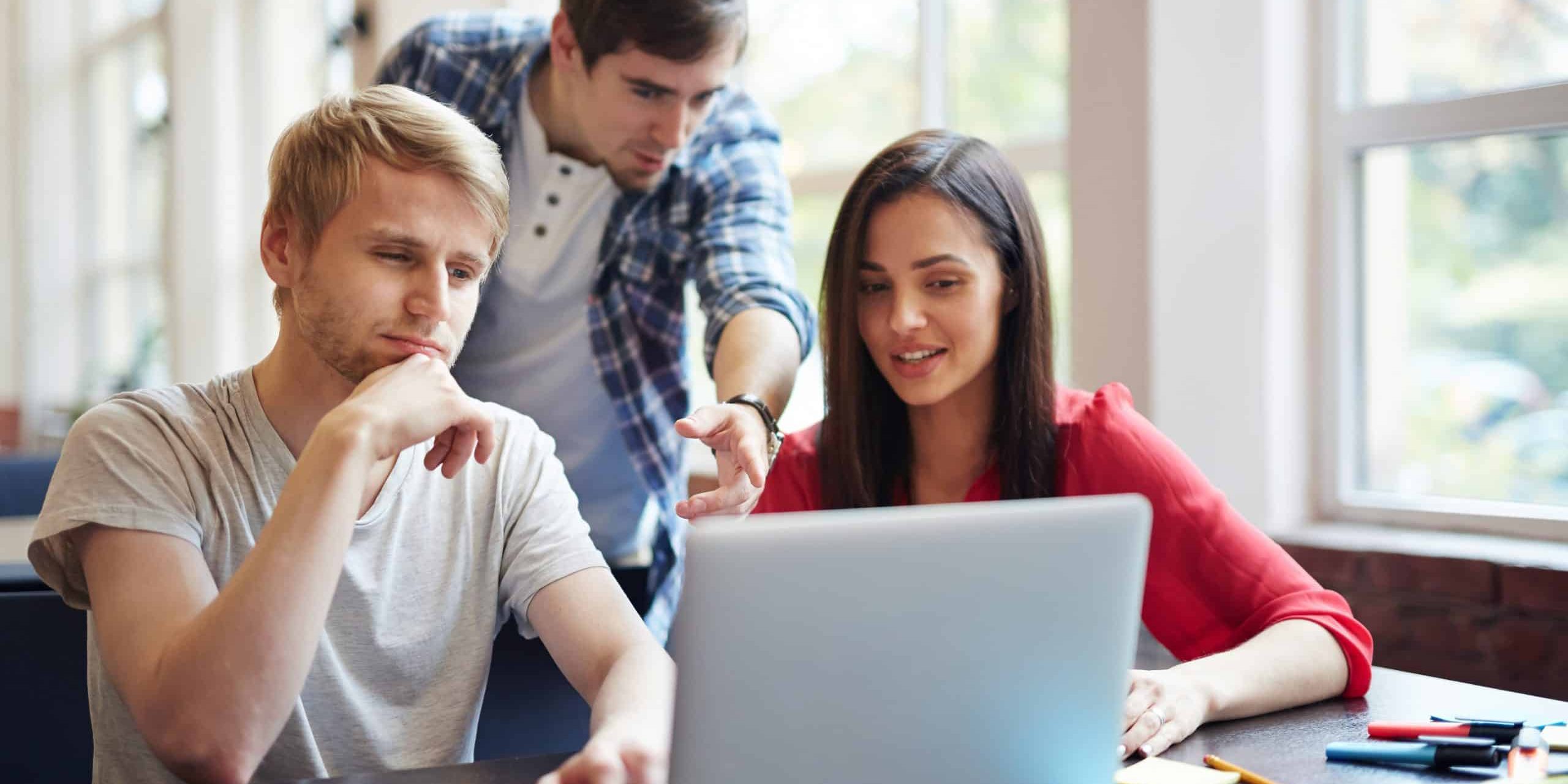 Group of teenage students discussing new educational video course at break